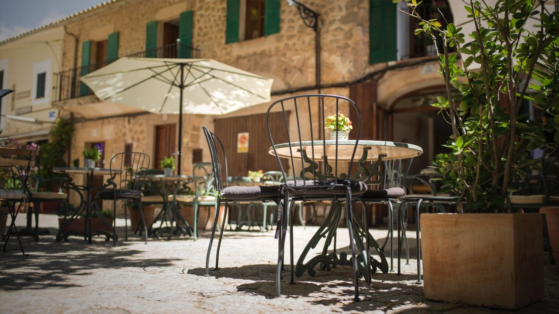 selective focus photography of table and chairs