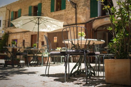 selective focus photography of table and chairs